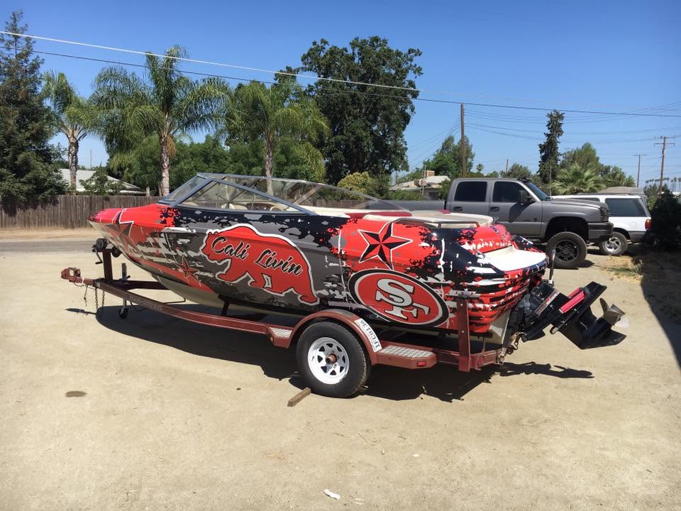 Ski boat in a red, black and grey custom marine wrap with California bear and 49ers graphics